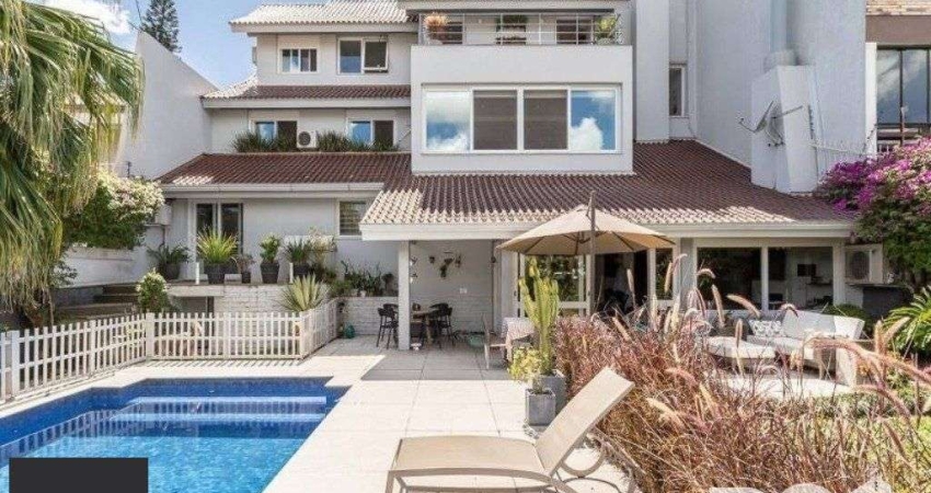 EXCLUSIVIDADE: Ampla casa de 476m² privativos, 4 suítes, 4 vagas no bairro Chácara das Pedras.