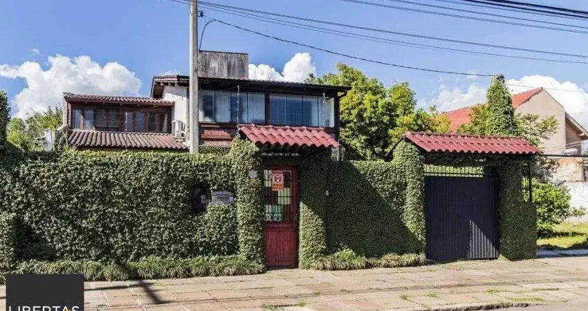 Casa com 3 quartos à venda na Avenida Guarujá, 140, Guarujá, Porto Alegre