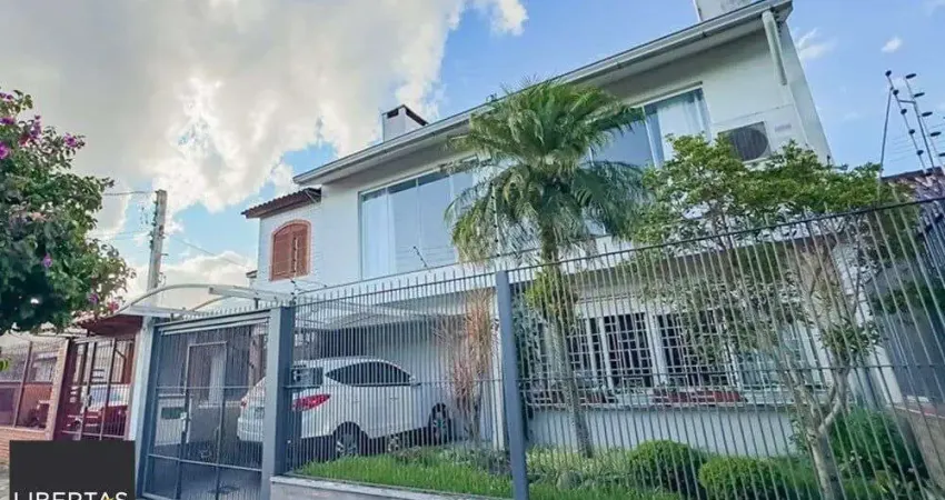 Casa com 4 quartos à venda na Rua Pedro Waine, 194, Santa Maria Goretti, Porto Alegre