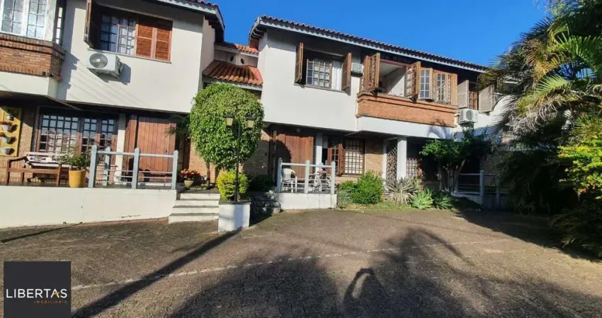 Casa em condomínio fechado com 3 quartos à venda na Avenida da Cavalhada, 6021, Cavalhada, Porto Alegre