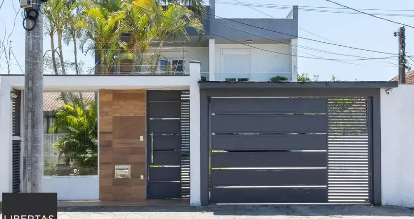 Excelente casa de 3 dormitórios, 3 suítes e 2 vagas no bairro cavalhada.