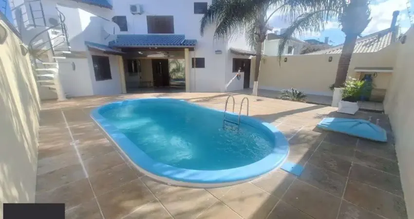 Casa 5 dormitórios, 1 suíte, piscina e 2 vaga de garagem em Canoas.