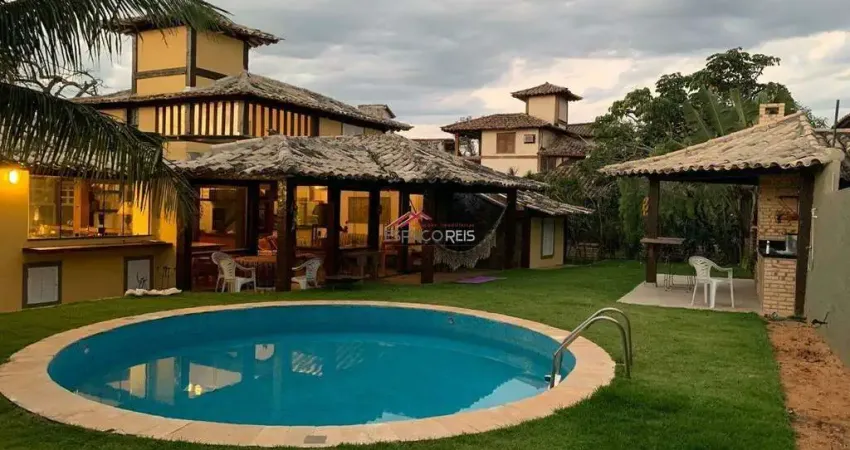 Vende casa em condomínio 04 suítes e area privativa com piscina e churrasqueira a 50m da praia de Manguinhos