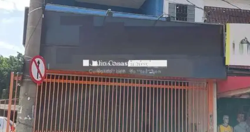 Salão comercial com apartamento e estacionamento a venda