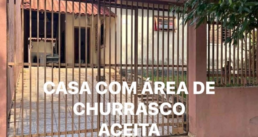 Casa com área de churrasco