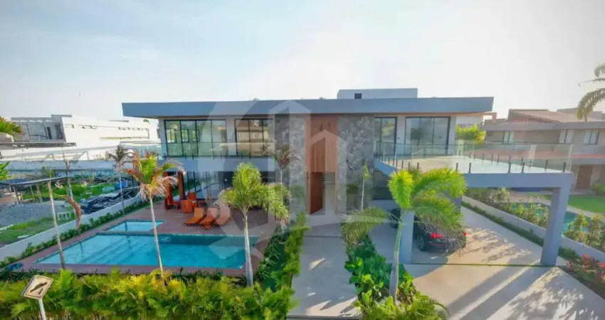 Viva o alto luxo: casa exclusiva com 5 suítes no condomínio morada da praia ii!