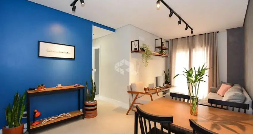 Apartamento à venda com 2 quartos sendo 1 suíte e 1 vaga de garagem no bairro centro em são josé/sc.