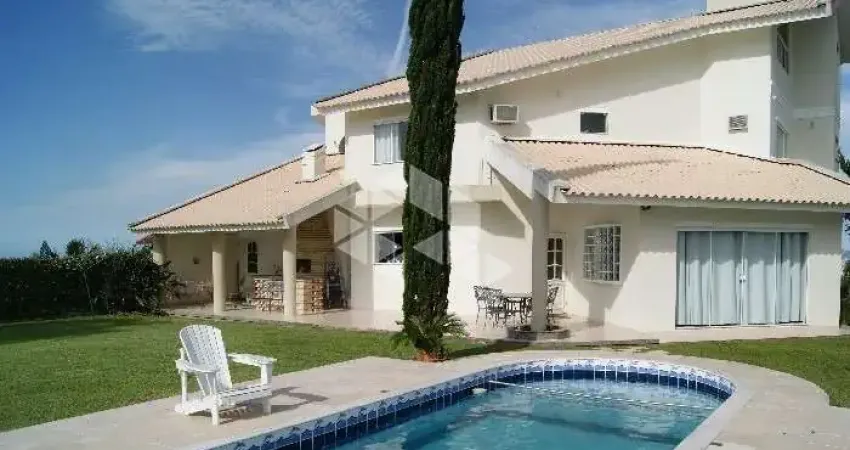 Casa no bairro bosque das mansões, em são josé, sc, mobiliada, sacada, espaço gourmet, churrasqueira, 05 dormitórios sendo 04 suítes, 6 vagas garagem.