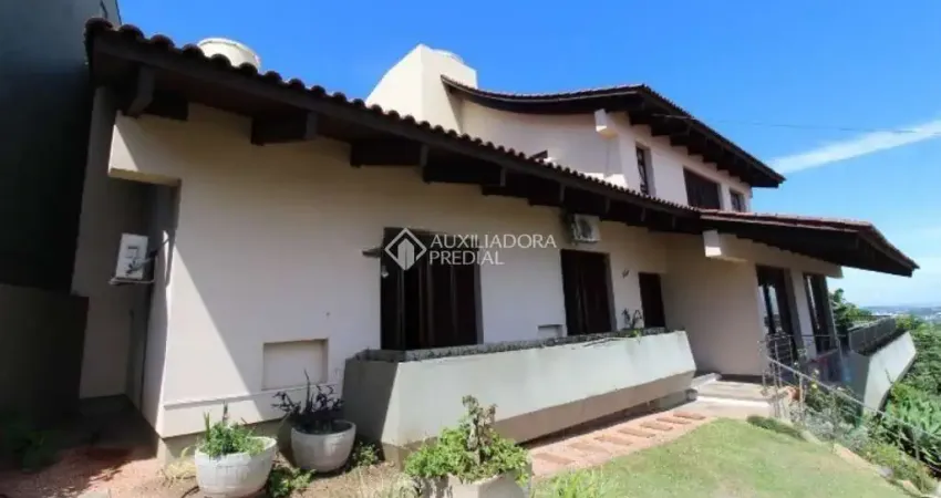 Casa em condomínio fechado com 5 quartos para alugar na Rua Alcebíades Antônio dos Santos, 356, Nonoai, Porto Alegre