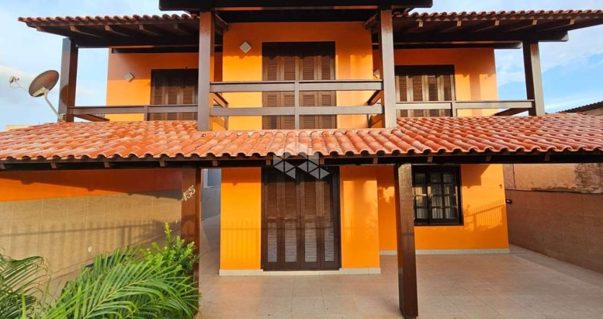 CASA 260M² 4 DORMITÓRIOS,  SENDO 1 SUÍTE, 2 VAGAS NO BAIRRO IGRA NORTE TORRES RS
