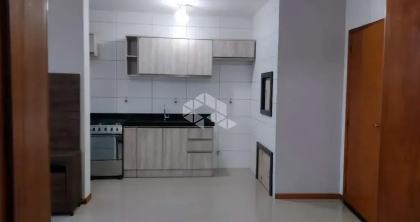 Apartamento no Centro de Tramandaí, com Elevador e Box coberto.