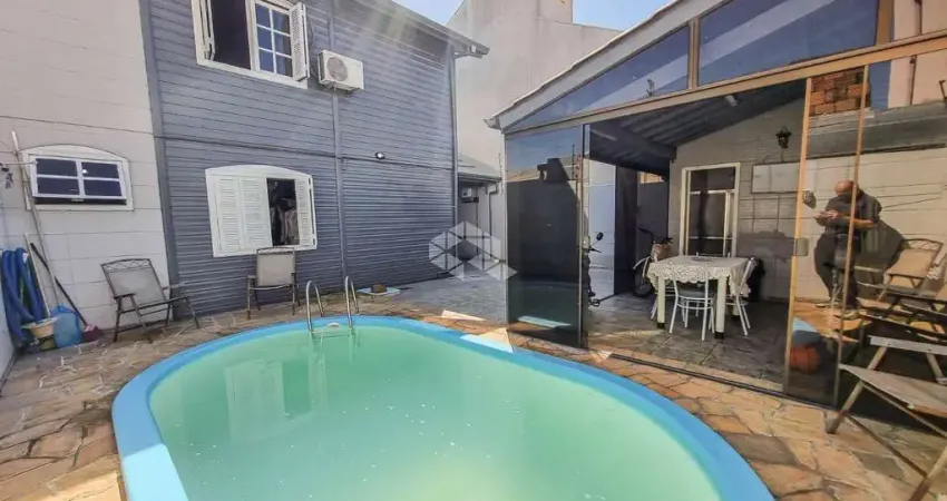 Casa à venda no bairro igara em canoas, 3 dormitórios, salão de festas, piscina e 3 vagas - aceita financiamento e fgts