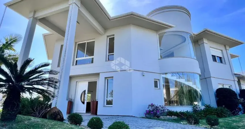 Sobrado mobiliado 4 suites condominio fechado capão da canoa rs