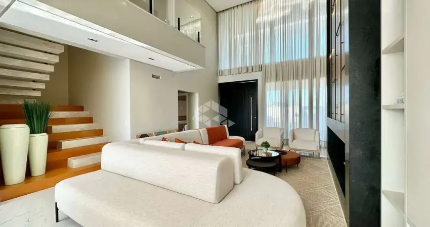 Belíssimo sobrado com 343 m² privativos, 04 suítes ( 01 térrea ) , 02 vagas/box, no condomínio Ilhas Resort, Capão da Canoa/RS