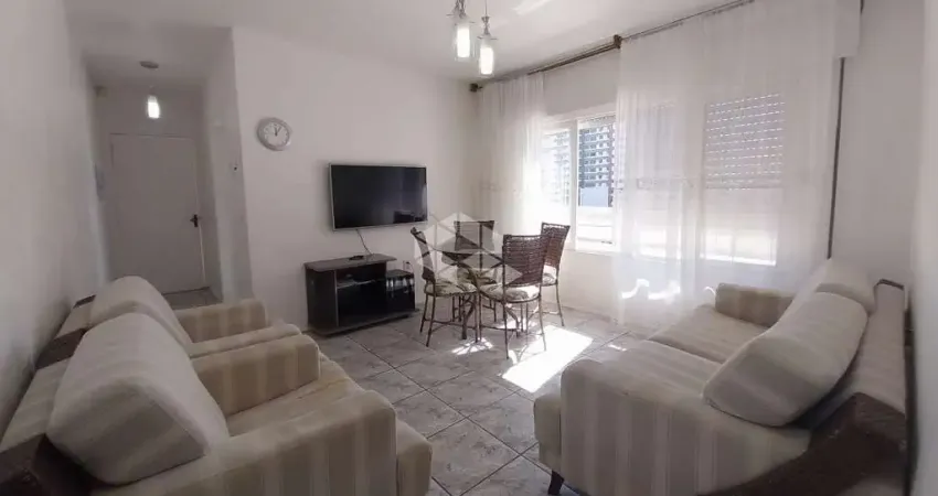 Apartamento de 1 dormitório mobiliado c/ box duplo no centro de capão da canoa