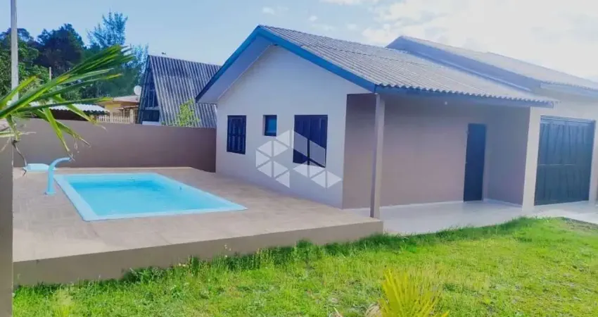 Casa com 2 dormitórios mobiliada com garagem fechada em arroio teixeira