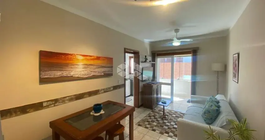 Apartamento de 1 dormitório mobiliado c/ churrasqueira box de garagem + depósito no centro de capão da canoa