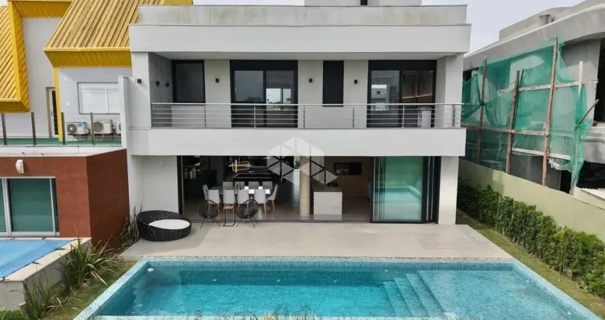 Sobrado com 04 dormitórios , 357 m² área privativa, mobiliado e decorado no condomínio fechado capão ilhas !!