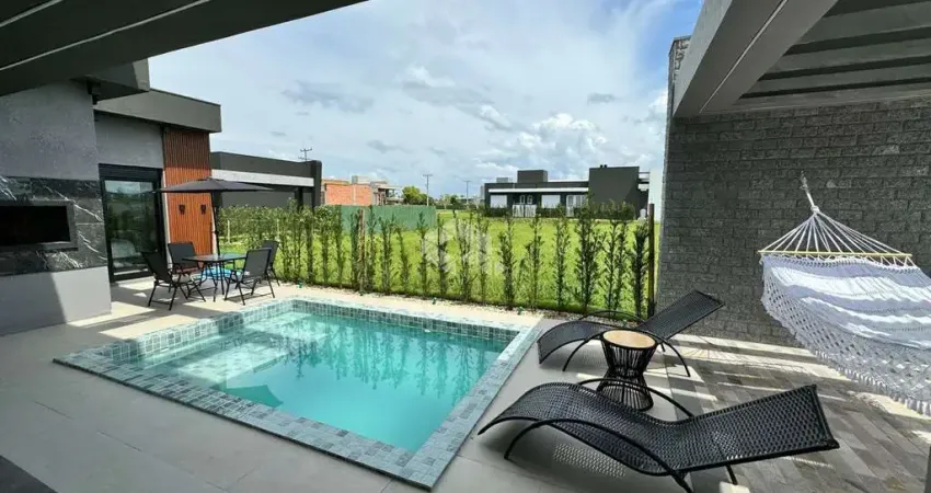 Casa em condomínio com 4 suítes mobliada e com piscina em capão da canoa