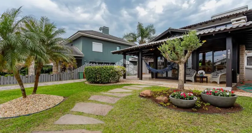 Casa térrea com 3 dormitórios, lote com 502m² no condomínio fechado Capão da Canoa