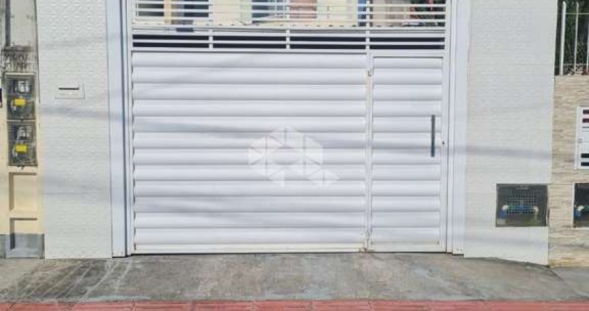 CASA GEMINADA 2 DORMITÓRIOS SEMI MOBILIADA 1 VAGA DE GARAGEM FORQUILHAS SÃO JOSÉ/SC