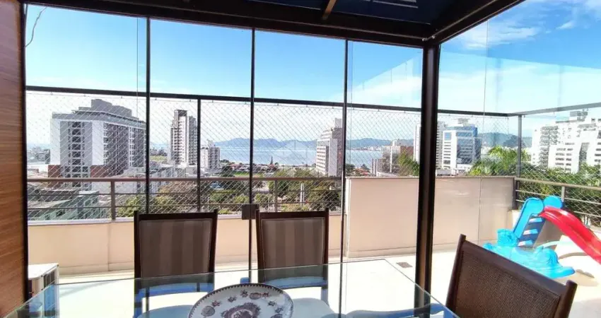 COBERTURA COM 3 QUARTOS SENDO 1 SUÍTE VISTA MAR E TERRAÇO NO CANTO EM FLORIANÓPOLIS