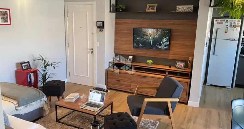 Apartamento com 2 quartos sendo 1 suíte e sacada com churrasqueira em coqueiros florianópolis