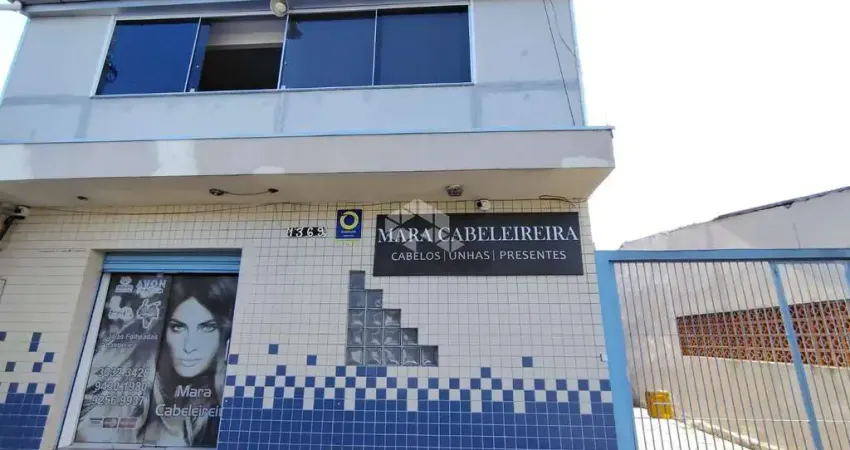 Sobrado com loja comercial e residencia com 3 dormitorios nos fundos na av. a j renner.