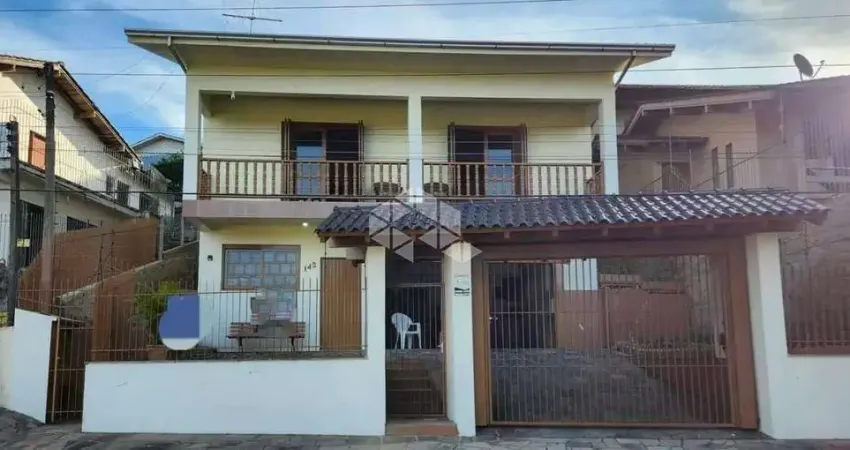 Casa a venda no bairro Primavera em Novo Hamburgo/RS, 3 dormitórios sendo 1 suíte, Aceita financiamento bancário.