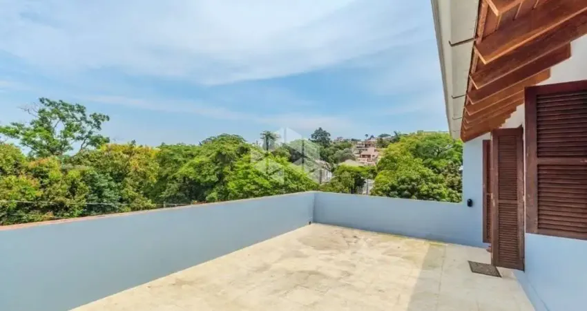 Casa com 3 quartos à venda na Avenida Cruz Alta, 188, Nonoai, Porto Alegre