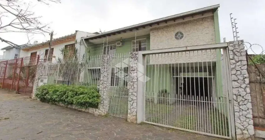 Casa com 5 quartos à venda na Rua Guilherme Alves, 154, Partenon, Porto Alegre