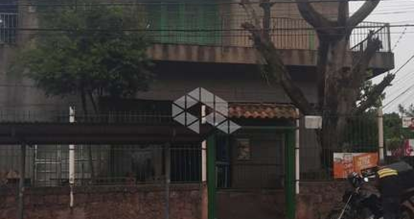 Prédio misto comercial/residencial com 2 apartamentos de 2 dormitórios