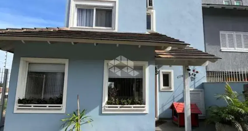 Casa com 3 quartos à venda na Rua Henrique Anawate, 470, Guarujá, Porto Alegre