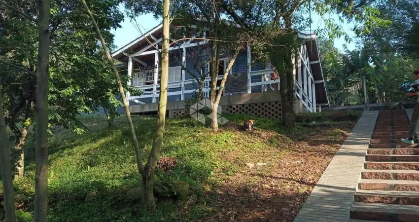 Casa com 2 quartos à venda na Rua Flor de Jacarandá, 6, Vila Nova, Porto Alegre