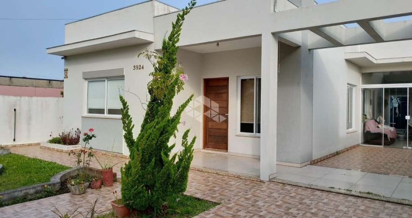 Linda casa térrea com 3 dormitórios, duas suítes e arquitetura moderna a venda em passo de Torres.