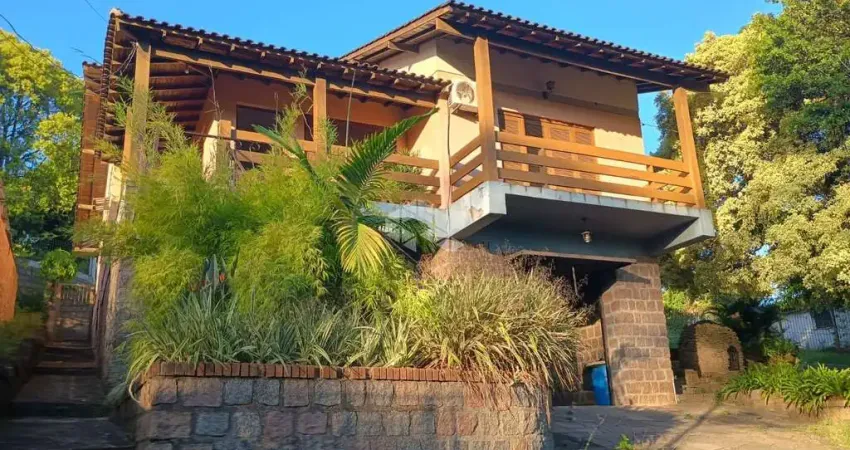 Casa com 3 quartos à venda na Avenida Vicente Monteggia, 2486, Cavalhada, Porto Alegre