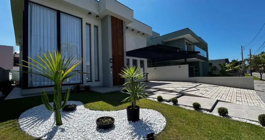Sobrado a venda em condominio (alto padrao) com 4 suites/ area de lazer completa (churrasqueira, sauna e piscina) no bairro massaguacu, caraguatatuba, sp.