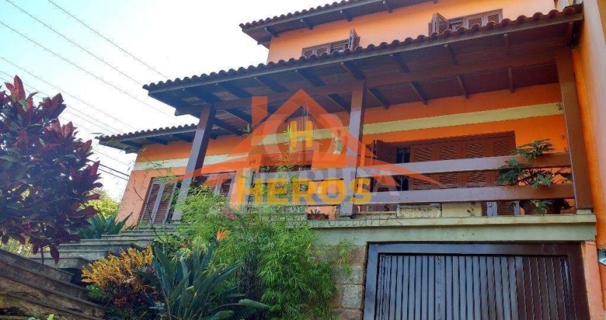 Casa com 5 quartos à venda na Rua Ângelo Passuelo, 79, Vila Nova, Porto Alegre