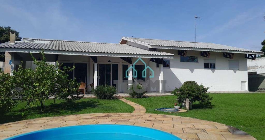 Casa com 4 dormitórios à venda, 346 m² por R$ 2.100.000,00 - Condomínio Vale do Sol - Tremembé/SP