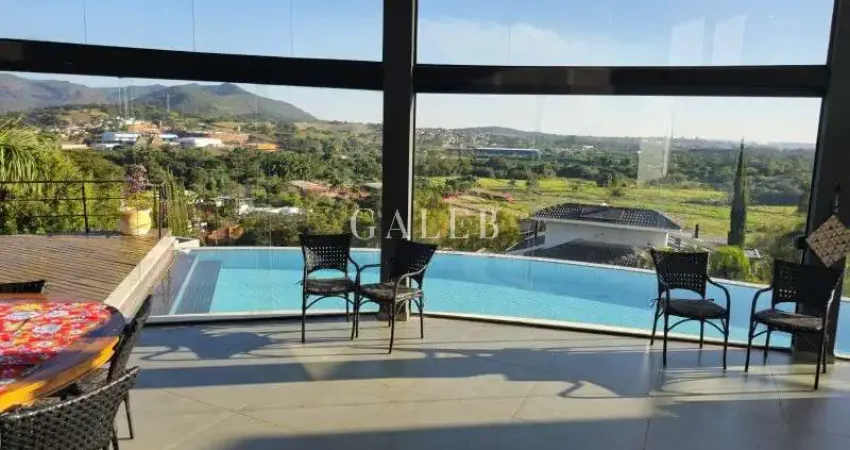 Casa de luxo em condomínio: 3 quartos, 3 suítes, 4 salas, 6 banheiros, 12 vagas de garagem e 564m² em atibaia-sp.