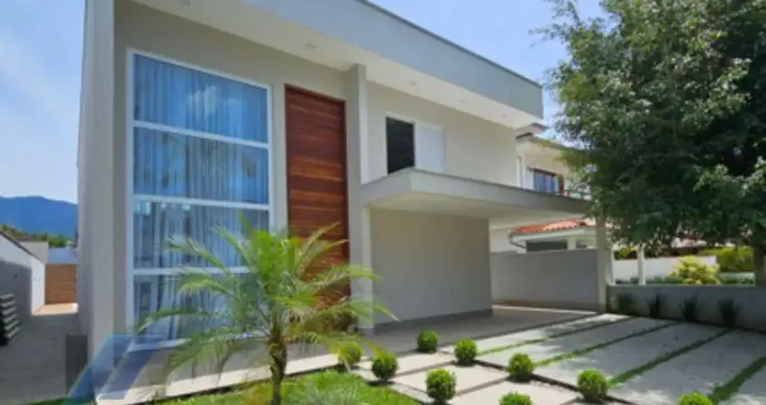 Ubatuba - condomínio park hills, casa nova com 04 suítes e área de lazer.