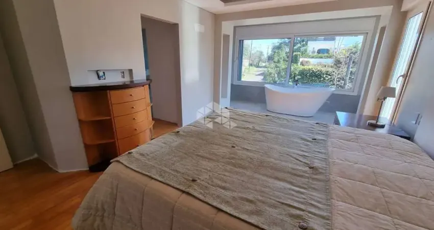Lindíssima e ampla casa com 03 dormitórios 1 suíte, vista para o Guaíba e piscina