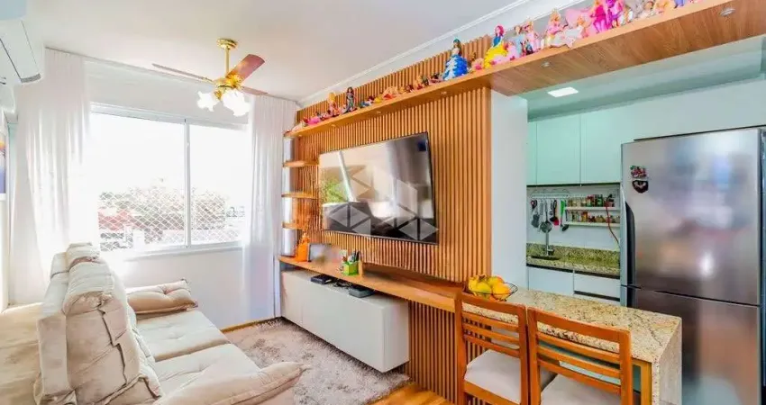 Apartamento 2 quartos sendo uma suíte, 1 vagas de garagem, living com churrasqueira, mobiliado com móveis planejados.