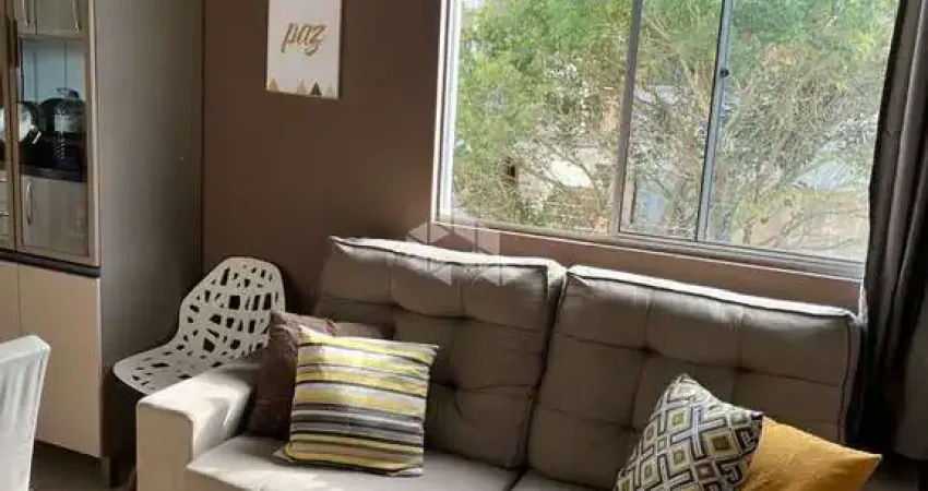 Apartamento a venda de 2 dormitórios semimobiliado em condomínio com vaga na restinga.