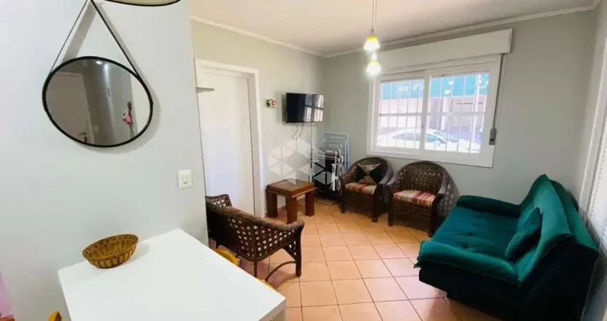 Apartamento de 2 dormitórios de frente no centro de capão da canoa com box/vaga de garagem