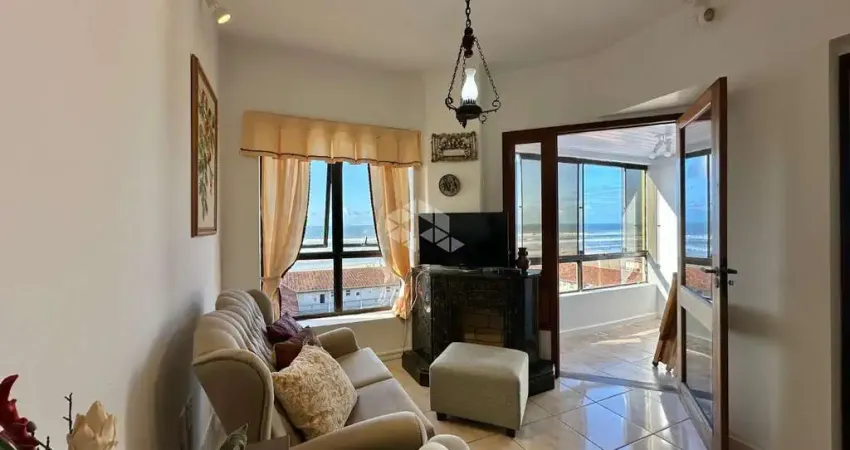 Apartamento de 3 dormitórios sacada com churrasqueira mobiliado, posição solar l/s/o no centro em capão da canoa