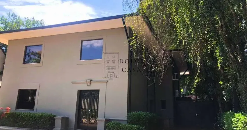 Casa comercial no Jardim América - sala de vidro em meio a natureza