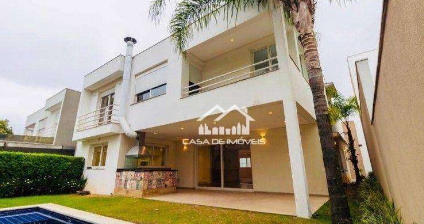 Vende magnífica casa em condomínio com 620m², 4 suítes e lazer.