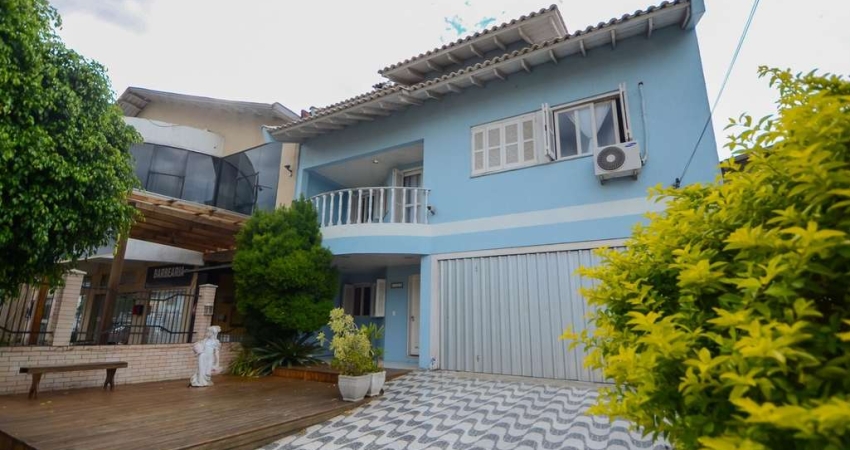 Sobrado com 5 quartos e 3 suítes no bairro Barnabé em Gravataí com amplo terreno