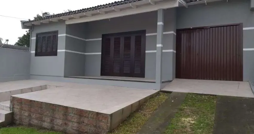 Casa com 2 Dormitórios, Garagem Coberta e Área Gourmet - Conforto e Praticidade Esperam por Você